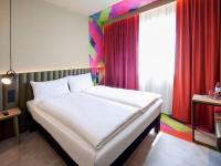 Posteľ alebo postele v izbe v ubytovaní ibis Styles Parndorf Neusiedler See