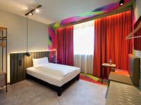 Posteľ alebo postele v izbe v ubytovaní ibis Styles Parndorf Neusiedler See