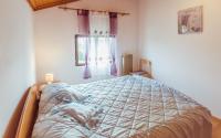 Posteľ alebo postele v izbe v ubytovaní Apartment Luciana 1