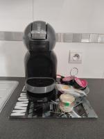 a coffee maker sitting on top of a kitchen counter at STUDIO COSY LE Ti PARIS WIFI &amp; NETFLIX in Deuil-la-Barre