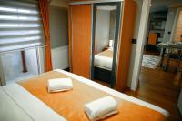 A bed or beds in a room at Umut Apartments