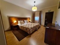 Uma cama ou camas num quarto em Quinta de Santo Estêvão Hotel Rural