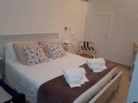 A bed or beds in a room at La Rosa dei Sassi 2