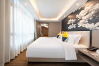 GHIC The Mulian Hotel of Bio-island Guangzhouにあるベッド