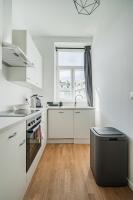 A kitchen or kitchenette at easy flat Margareten Apartments
