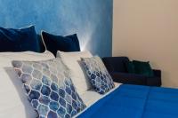 Posteľ alebo postele v izbe v ubytovaní La Locandiera B&B