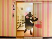 a door with a cartoon bear painted on it at Hey Bear Capsule Hotel in Taipei