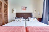 A bed or beds in a room at Casa Violeta