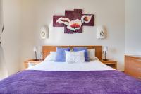 A bed or beds in a room at Casa Violeta