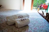 Łóżko lub łóżka w pokoju w obiekcie Hotel Lago Bin