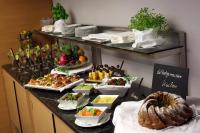 a buffet with a lot of food on a table at Holiday Inn Vienna City by IHG in Vienna