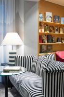 a living room with a couch and a table at Holiday Inn Vienna City by IHG in Vienna