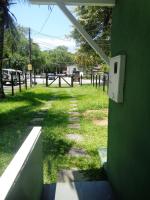 a view of a yard with a field of grass at Casa com Piscina Paraty in Paraty