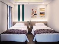 Postel nebo postele na pokoji v ubytování Darley Hotel Chiangmai