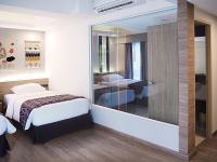 Postel nebo postele na pokoji v ubytování Darley Hotel Chiangmai