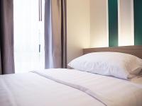 Postel nebo postele na pokoji v ubytování Darley Hotel Chiangmai