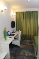 a hotel room with a desk with a laptop on it at Stop Hotel in Braşov