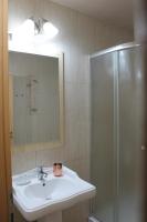 a bathroom with a sink and a shower at Stop Hotel in Braşov