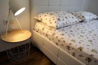 Postel nebo postele na pokoji v ubytování Apartments Villa Kristina