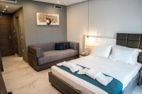 A bed or beds in a room at Lagaria Hotel