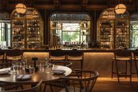 a restaurant with tables and chairs and a bar at Berns Hotel - Boutique Hotel in the heart of Stockholm in Stockholm