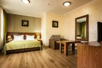 Postel nebo postele na pokoji v ubytování SPA Hotel Elbrus