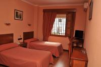Postel nebo postele na pokoji v ubytování Hotel Los Castaños