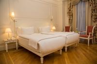 Postel nebo postele na pokoji v ubytování Corinne Art & Boutique Hotel