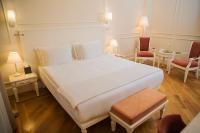 Postel nebo postele na pokoji v ubytování Corinne Art & Boutique Hotel