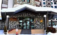 The facade or entrance of Rhodopi Home Hotel Chepelare - Half Board & All inclusive