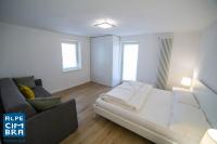 Łóżko lub łóżka w pokoju w obiekcie Trentino Apartments - Casa ai Tolleri