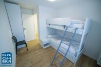 Łóżko lub łóżka w pokoju w obiekcie Trentino Apartments - Casa ai Tolleri