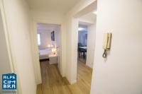 Łóżko lub łóżka w pokoju w obiekcie Trentino Apartments - Casa ai Tolleri