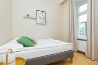 Łóżko lub łóżka w pokoju w obiekcie Apartments Warsaw Targowa by Noclegi Renters