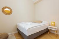 Łóżko lub łóżka w pokoju w obiekcie Apartments Warsaw Targowa by Noclegi Renters