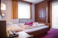Posteľ alebo postele v izbe v ubytovaní Rider Hotel Obereggen