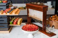 a buffet with a plate of food on a table at InterContinental Sydney Double Bay by IHG in Sydney