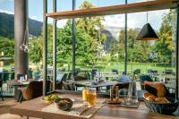 a table with food on it in a restaurant at TUI BLUE Montafon in Schruns-Tschagguns