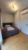 A bed or beds in a room at Wiener Maisonette mit Terrasse