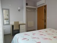 Posteľ alebo postele v izbe v ubytovaní Apartamentos Playa Compostela