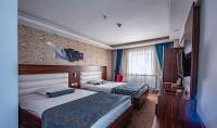 Postel nebo postele na pokoji v ubytování Madi otel