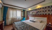 Postel nebo postele na pokoji v ubytování Madi otel