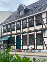 a building with two bikes parked in front of it at Pension Karina Schwerin in Schwerin