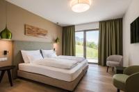Posteľ alebo postele v izbe v ubytovaní Oliven- & Genusshotel Hirzer