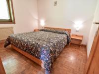 A bed or beds in a room at Apartment Fontanelle-1 by Interhome