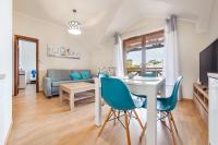 Televízia a/alebo spoločenská miestnosť v ubytovaní Apartamenty Sun & Snow Rezydencja Park