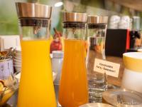 two bottles of orange juice sitting on a counter at Pension Ehrenfried - Hotel garni in Kindberg