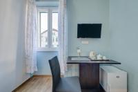 Televízia a/alebo spoločenská miestnosť v ubytovaní Rooms Lucia