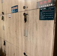 a large wooden wall with signs on it at 角舍背包客棧 -近火車站 in Hualien City
