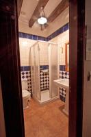 a bathroom with a shower and a toilet and a sink at Hostal El Cortijo in Algodonales